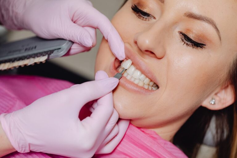 arafed woman getting her teeth brushed by a dentist