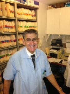 arafed man in a lab coat standing in front of a shelf of milk