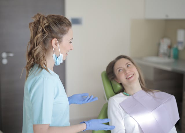 person consulting with a dentist