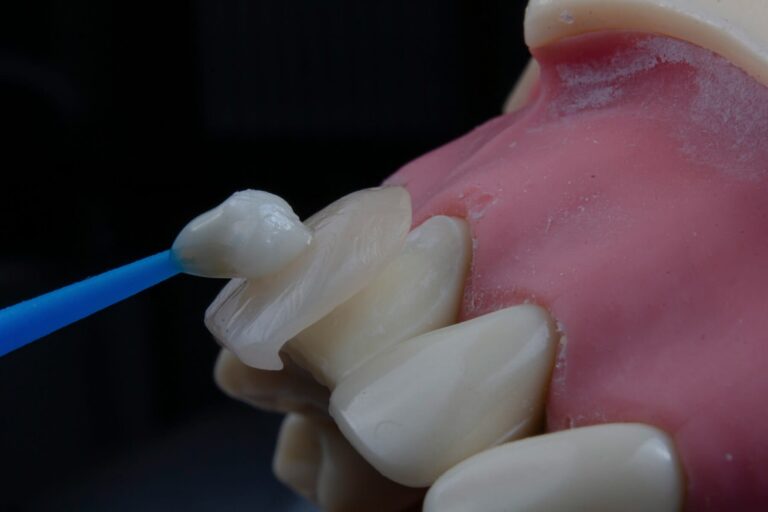 a close up of a toothbrush being used to clean a tooth