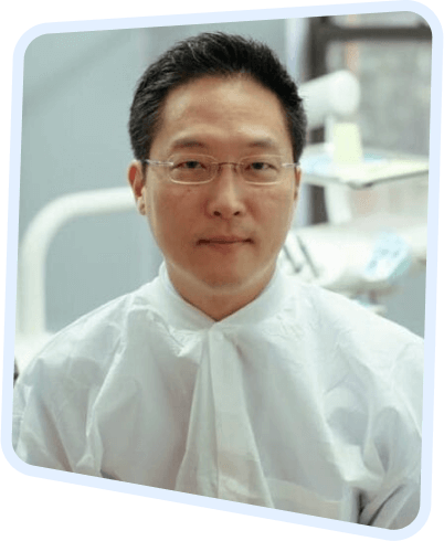 arafed man in a white shirt and glasses in a hospital room