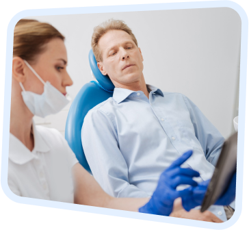 a woman in a blue shirt and a man in a white shirt and blue gloves