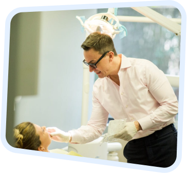 a man in a pink shirt is getting a facial treatment