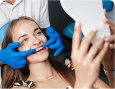 arafed woman getting her teeth examined by a dentist