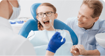 arafed woman sitting in a chair with a dentist and a man