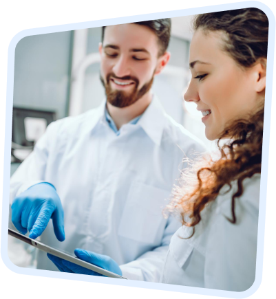 a close up of a person in a lab coat and gloves holding a tablet