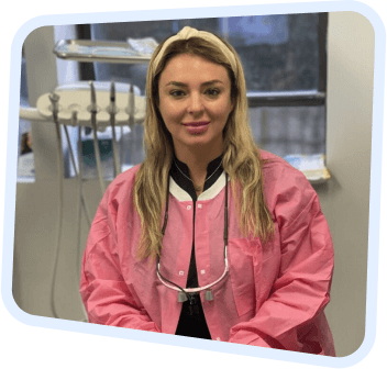 a close up of a woman in a pink coat with a stethoscope