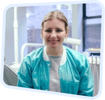 arafed woman in a blue jacket sitting in a dental chair