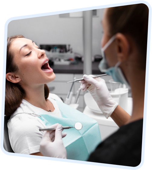 arafed woman in a dentist chair with a toothbrush and a pair of scissors