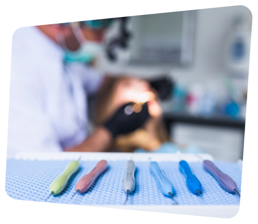 there are many dental tools on a table in a room