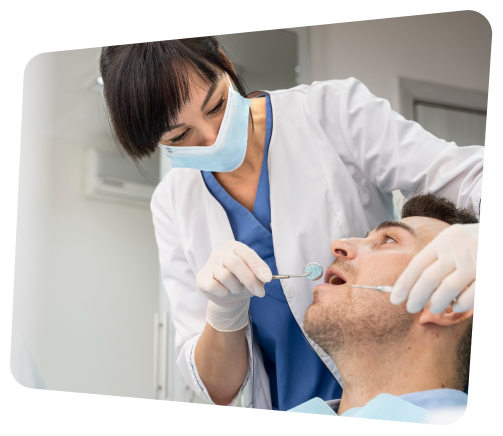 arafed man getting his teeth examined by a dentist