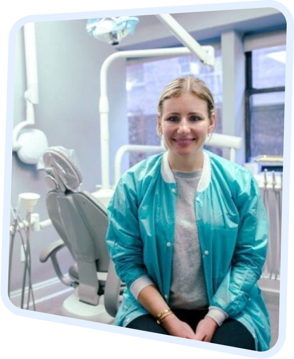 smiling woman sitting in dental chair in dental office with open window