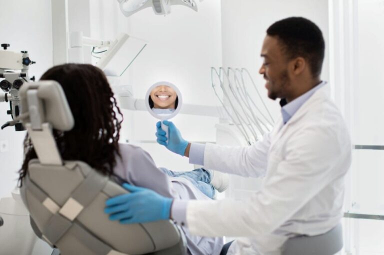 arafed woman sitting in a chair with a dentist in the background