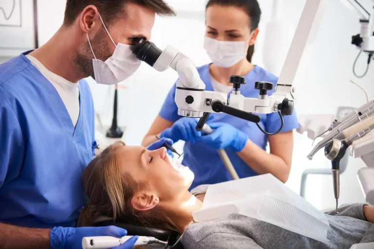 arafed woman with a dentist looking through a microscope