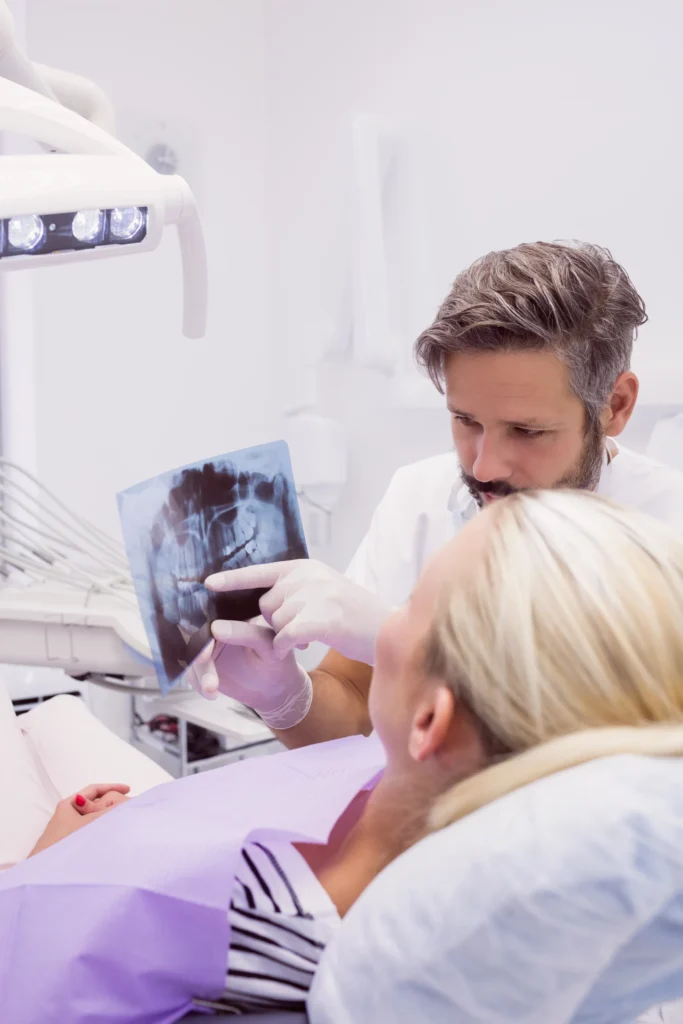 dentist-showing-x-ray-patient